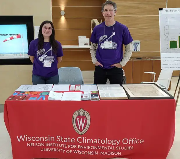 Bridgette Mason and Steve Vavrus promoting the State Climatology Office at an event.