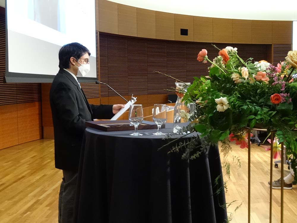 Michael Notaro, interim director of the Center for Climatic Research, speaks to the audience from a podium