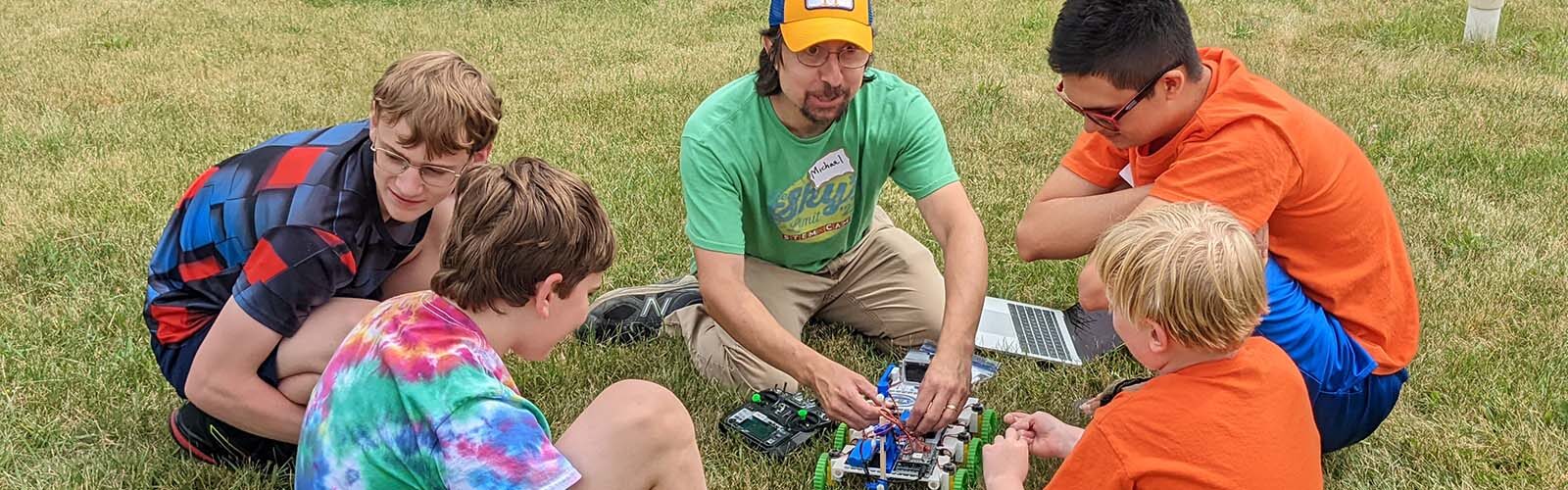 STEM camp participants learn how to use a remote-controlled robot